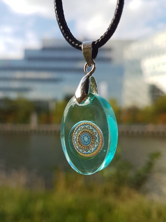 Necklace with oval pendant made of epoxy resin