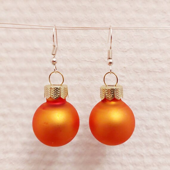 Christmas earrings with orange and cream balls