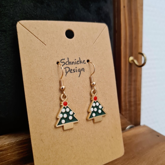 Earrings with a snow-covered Christmas tree