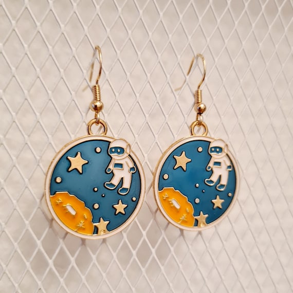 Enamel astronaut in space earrings