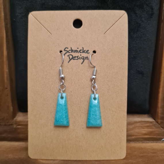 Earrings made of turquoise epoxy resin in trapezoid shape