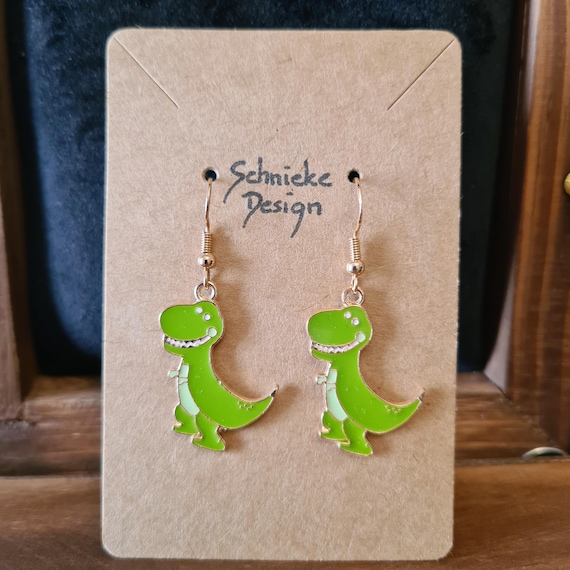 Earrings with dinosaurs made of enamel