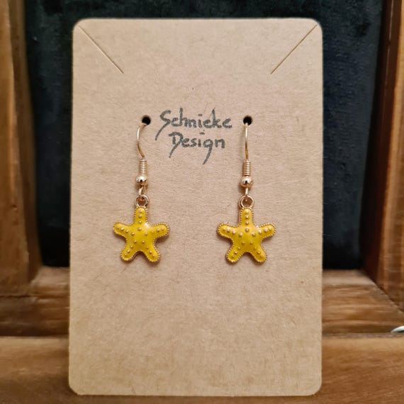 Earrings with starfish made of enamel
