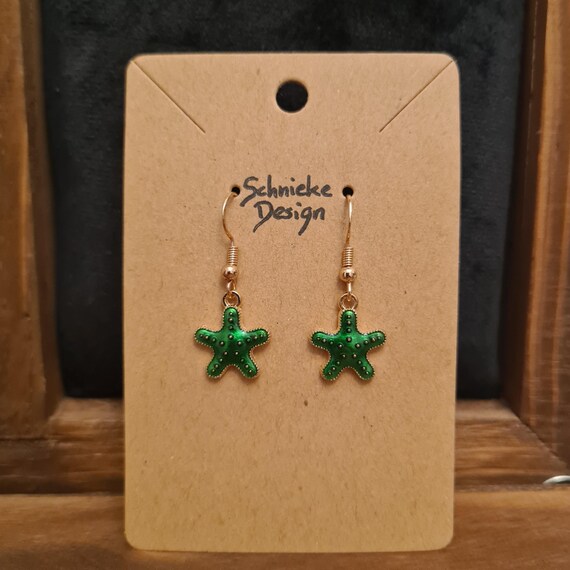Earrings with dark green enamel starfish