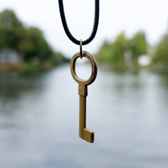 Black chain with bronze steampunk key