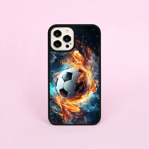 May include: Black phone case with a soccer ball engulfed in flames and smoke. The background is a dark blue with white stars.
