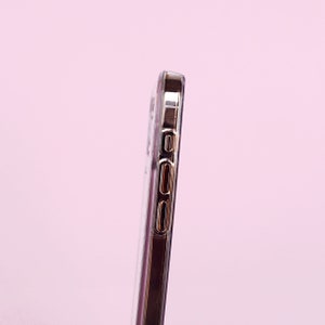 May include: A clear phone case with a gold trim around the edges. The case has cutouts for the buttons and camera.