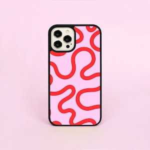 May include: A smartphone case with a black frame and a pink backdrop. The case displays a repeating pattern of red, wavy lines. The phone case is designed to fit a smartphone.