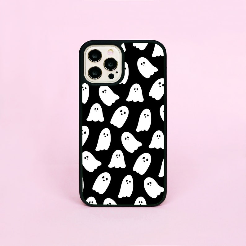 May include: Black phone case with a white ghost pattern.