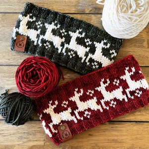 May include: Two knitted headbands with a reindeer pattern. One headband is green with white reindeer, the other is red with white reindeer. Both headbands have a brown leather tag with the text "Made with Love" on them.