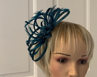 Teal feather fascinator hairband /comb, this style can be made in over 80 colours, contact me with the colour of your outfit for me to match