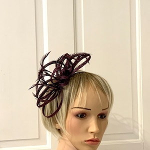 Aubergine feather fascinator, small plum feather fascinator on hairband or comb. this style can be made in over 80 colours, send me an email