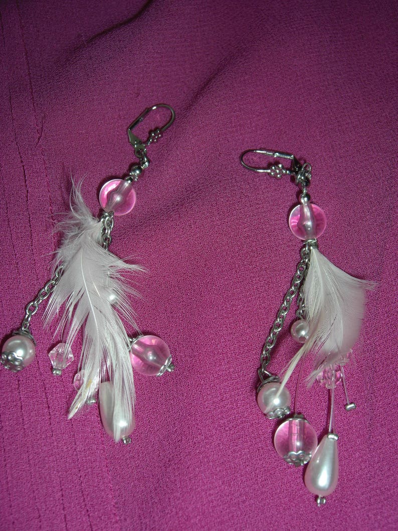 Transparent pink beads and feather earrings