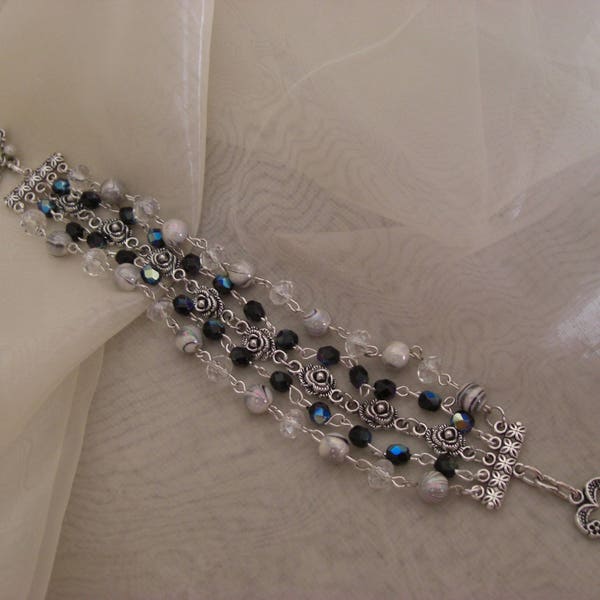 Bracelet Perles Cristal, toupies noires irisées , chaine de roses