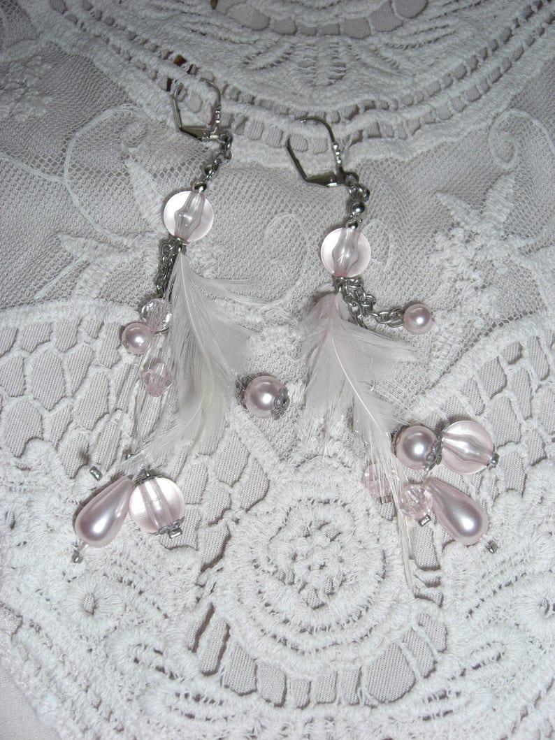 Transparent pink beads and feather earrings
