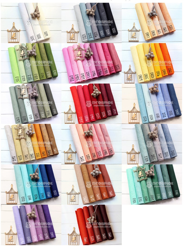 Puede incluir: Una colecci&oacute;n de 30 rollos de tela de fieltro en varios colores, incluyendo blanco, gris, verde, rosa, rojo, naranja, azul, marr&oacute;n, beige y morado. Los rollos est&aacute;n dispuestos en filas de seis, con cada rollo etiquetado con un n&uacute;mero.