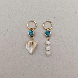 Asymmetrical upcycled earrings with mother-of-pearl and shells...