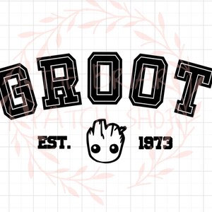 May include: Black and white graphic design with the word "GROOT" in a varsity style font. The design also includes a small image of a character from the movie Guardians of the Galaxy, with the text "EST. 1973" below.