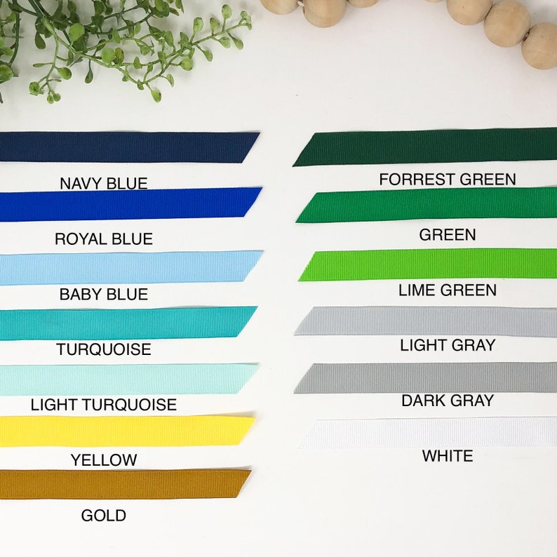 May include: A collection of ribbon samples in various colors, including navy blue, royal blue, baby blue, turquoise, light turquoise, yellow, gold, forrest green, green, lime green, light gray, dark gray, and white.