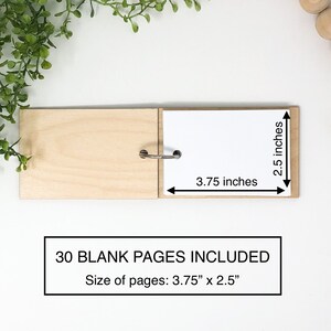 May include: A small wooden bound journal with 30 blank pages. The journal is 3.75 inches wide and 2.5 inches tall.  The pages are 3.75 inches wide and 2.5 inches tall.