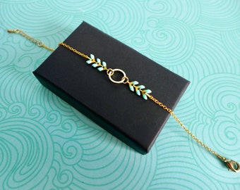 Graphic bracelet with golden ring and turquoise epi chain, thin light blue colored bracelet, Mother's Day gift bracelet