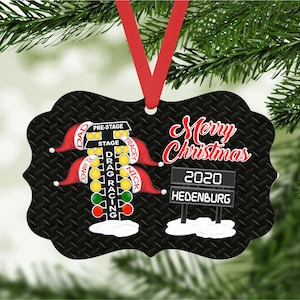 May include: Black Christmas ornament with a drag racing Christmas tree light and a scoreboard that says "Merry Christmas 2020 Hedenburg".