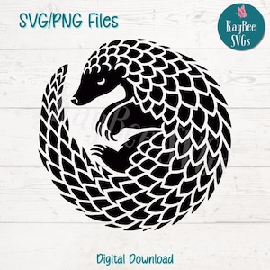 May include: Black and white silhouette of a curled up pangolin with scales. The pangolin is curled into a circle with its tail wrapped around its body. The image is on a white wooden background.