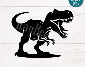 May include: Black silhouette of a Tyrannosaurus Rex dinosaur with its mouth open, standing on a white wooden background. The text "SVG/PNG Files" is at the top of the image and "Digital Download" is at the bottom.