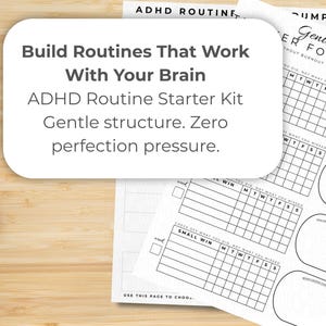 May include: A stack of white paper sheets with black text and grid layouts. The text includes "Build Routines That Work With Your Brain" and "ADHD Routine Starter Kit." The sheets are designed for tracking habits and goals.