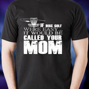 May include: Black t-shirt with a white graphic of a disc golf basket and the text "If disc golf were easy... it would be called your mom."