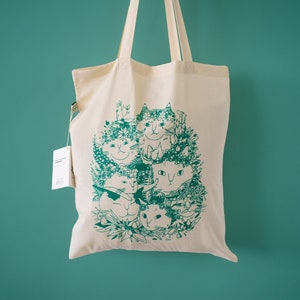 Summer bouquet tote bag | Hand screen printed green illustration of 7 cats with flowercrowns and other plants on natural organic cotton bag