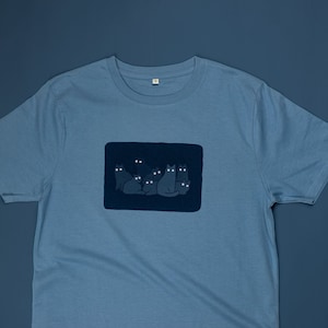 Reflecting cat eyes t-shirt | Hand screen printed on blue organic cotton tee with reflective ink