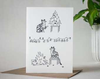 Vrolijke kerstkatkaart | Gevouwen kerstkaart, grappige kerstkaart met kattenillustratie, komische illustratie, slechte kat, kat die boom vernietigt