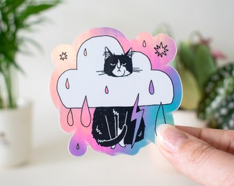 Rain Cloud Cat - Light mode | Holographic Vinyl Stickers of a grumpy Tuxedo Cat in a rain cloud costume