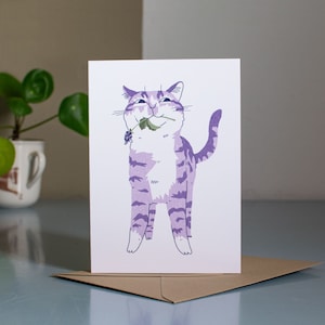 Apporter des cadeaux | Pour chaque occasion d'offrir, une carte de voeux avec une illustration de chat représentant un chat tigré qui avait un brin d'herbe à chat dans la gueule