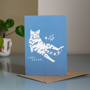 Life's tough | Greeting card with cat illustration for every occasion showing a tabby cat sitting on its butt and looking exhausted
