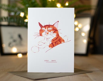 Cozy Days Christmas Card | Funny holiday Card, unique illustrations, Ginger Tabby Cat, Happy Cat, star fairy lights, cuddling up, cute card