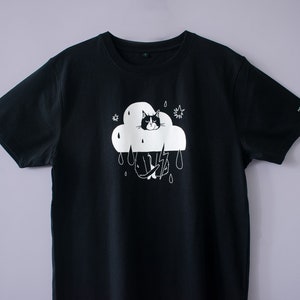 Rain Cloud Cat T-Shirt Hand screen printed on black organic cotton tee with white illustration of a not amused cat in a costume image 1