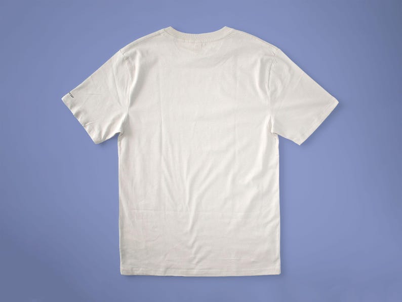 Cat gallery t-shirt | Hand screen printed on beige organic cotton tee with black and blue illustration of a cat judging his own art image 6