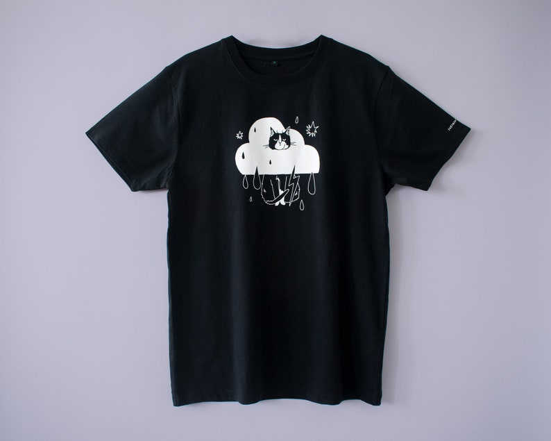 Rain Cloud Cat T-Shirt Hand screen printed on black organic cotton tee with white illustration of a not amused cat in a costume image 4