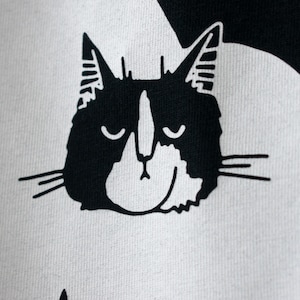 Rain Cloud Cat T-Shirt Hand screen printed on black organic cotton tee with white illustration of a not amused cat in a costume image 3