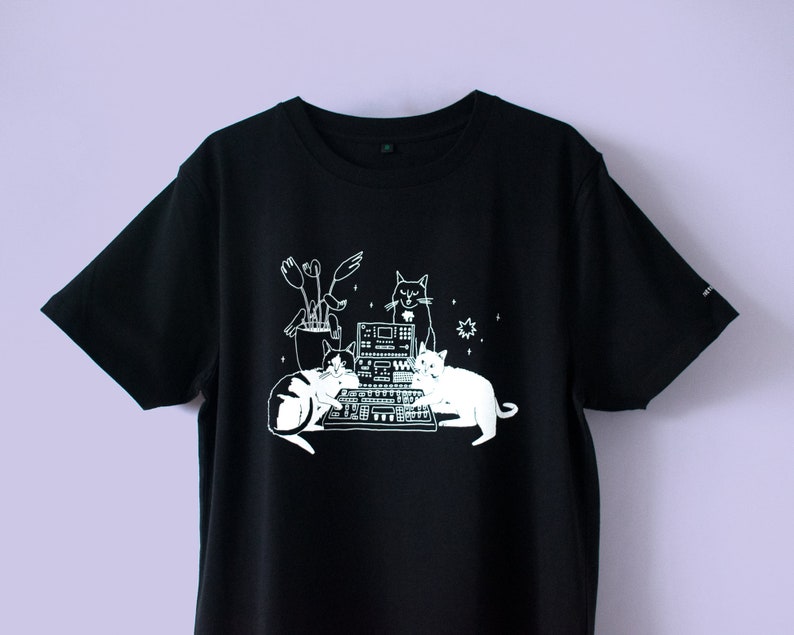 T-Shirt of Cats sitting on Synthesizer Illustrated dj cats screen printed on black organic cotton t-shirt with water-based white ink No