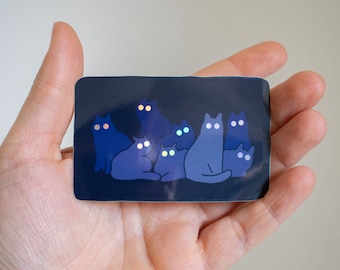 Reflecting Cat Eyes | Spooky holographic vinyl sticker of a cat gangs silhouettes who's eyes are glowing in the night