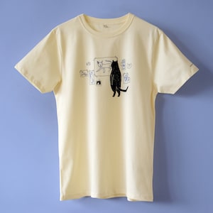 Cat gallery t-shirt Hand screen printed on ecru/light yellow organic cotton tee with black and blue illustration of a cat judging cat art image 3