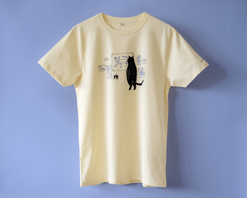 Cat gallery t-shirt Hand screen printed on ecru/light yellow organic cotton tee with black and blue illustration of a cat judging cat art image 3