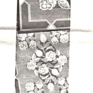 May include: Black and white filet crochet cloth pattern with a floral design. The pattern is labeled "Design 537" and "Filet Crochet Cloth".