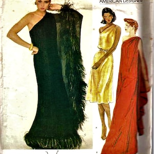 May include: A vintage sewing pattern for a long evening gown with a one-shoulder design. The pattern features three different styles, including a green gown with a feather trim, a gold gown with a draped neckline, and a red gown with a Grecian-inspired design. The pattern is by Very Easy Vogue, American Designer, Edith Head.