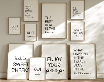 May include: A collection of ten framed wall art prints with black text on white backgrounds, featuring humorous bathroom-themed phrases including Wash Your Hands You Filthy Animal, The Best Seat In The House, and Enjoy Your Poop.