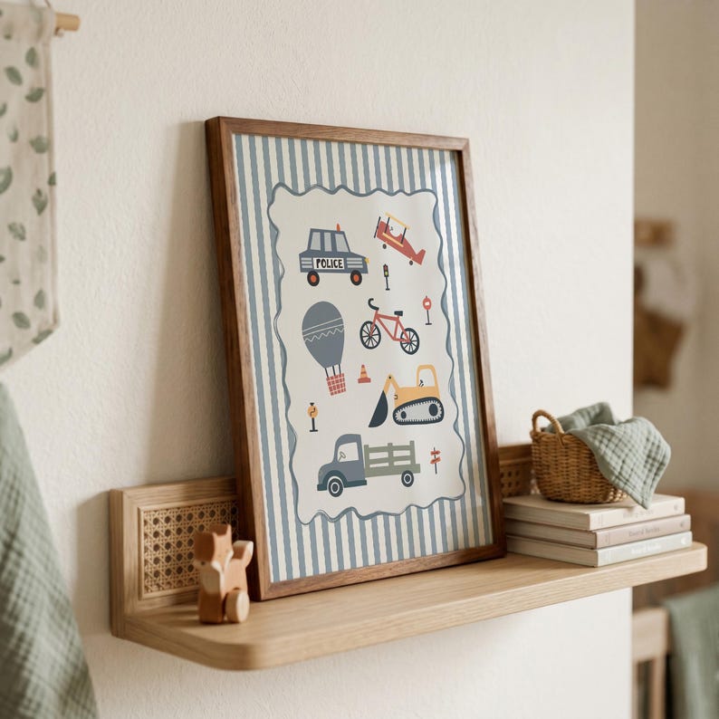 May include: A framed wall art print featuring a light blue and white striped background with a central scalloped panel displaying illustrations of a police car, airplane, bicycle, hot air balloon, excavator, and truck with various road signs.