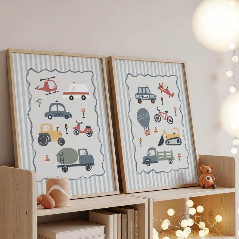 May include: Two framed wall art prints featuring illustrations of various vehicles including a helicopter, ambulance, taxi, tractor, cement mixer, police car, airplane, bicycle, hot air balloon, and excavator, set against a light blue striped background.